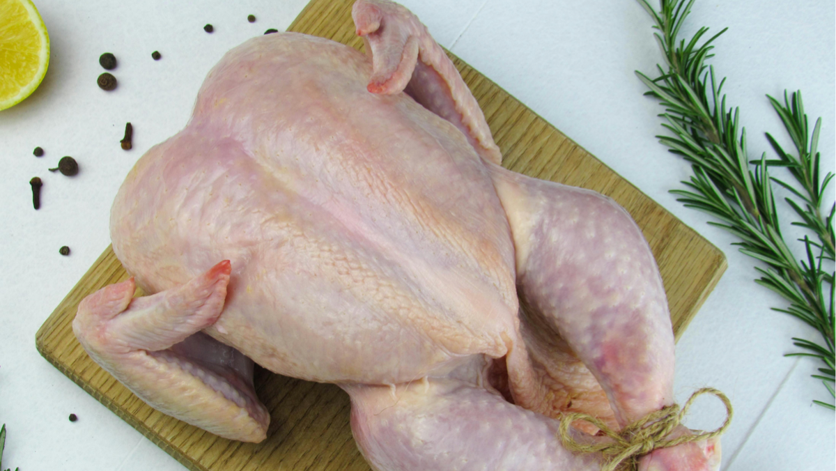 Halal-certified chicken preparation with focus on ethical handling and clean kitchen environment
