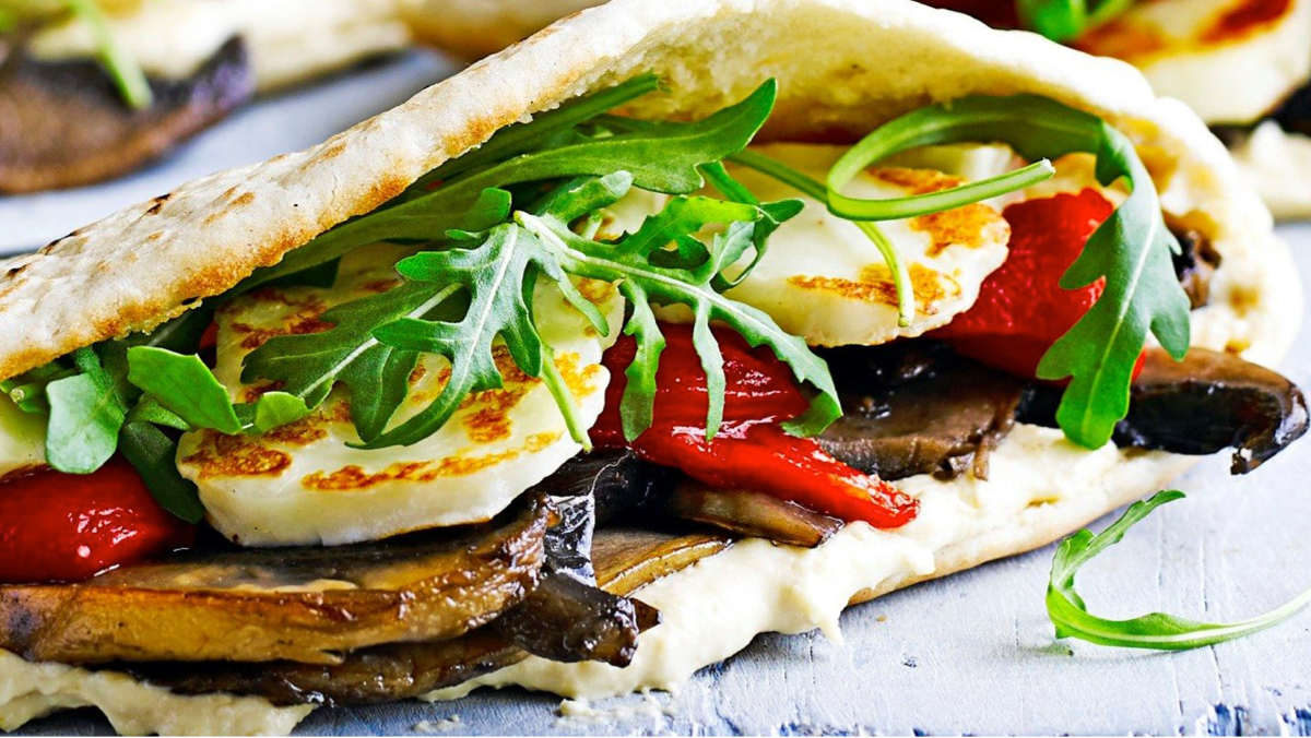 Grilled halloumi slices and crispy falafel balls served with salad and dips
