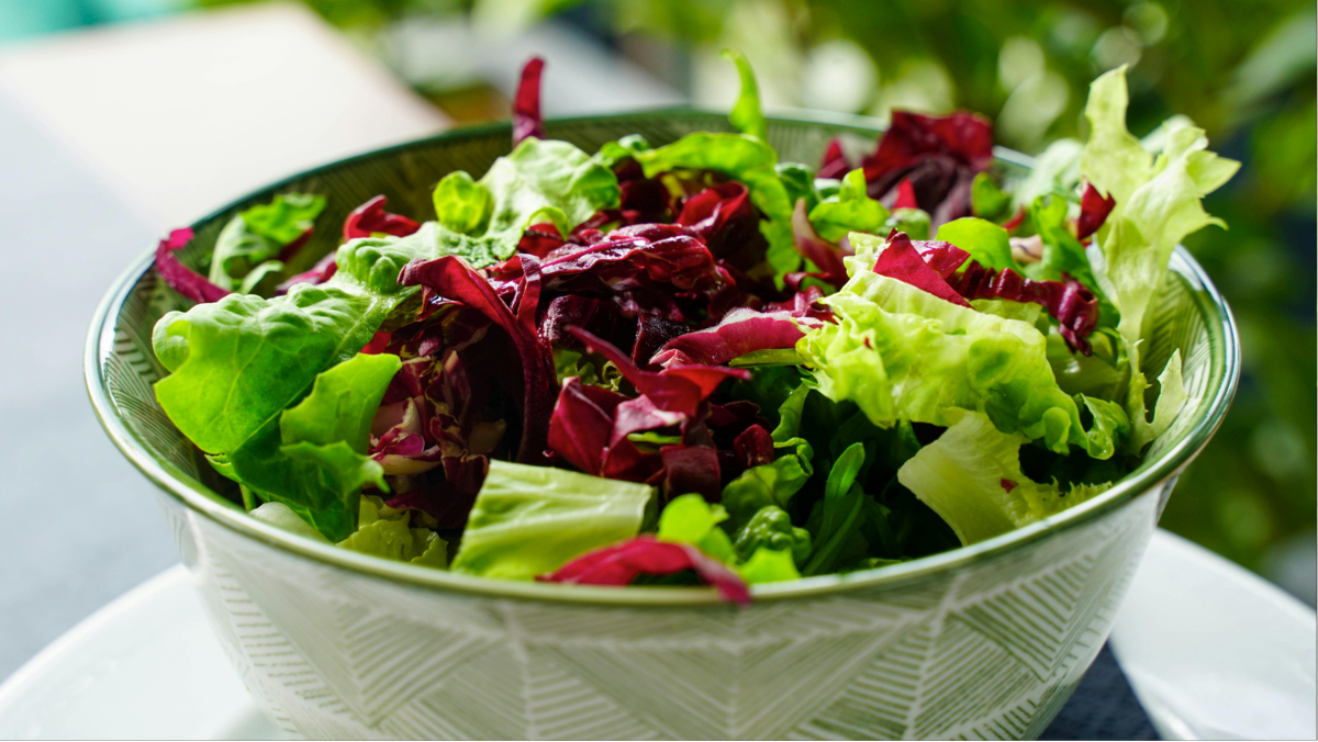 Platter of fresh salad served with garlic sauce