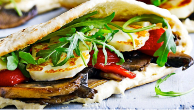 Grilled halloumi slices and crispy falafel balls served with salad and dips