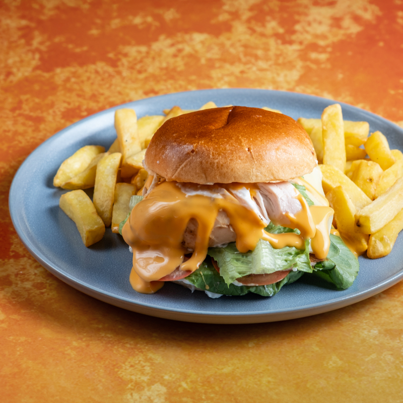 Chicken burger with lettuce and tomato in a toasted bun