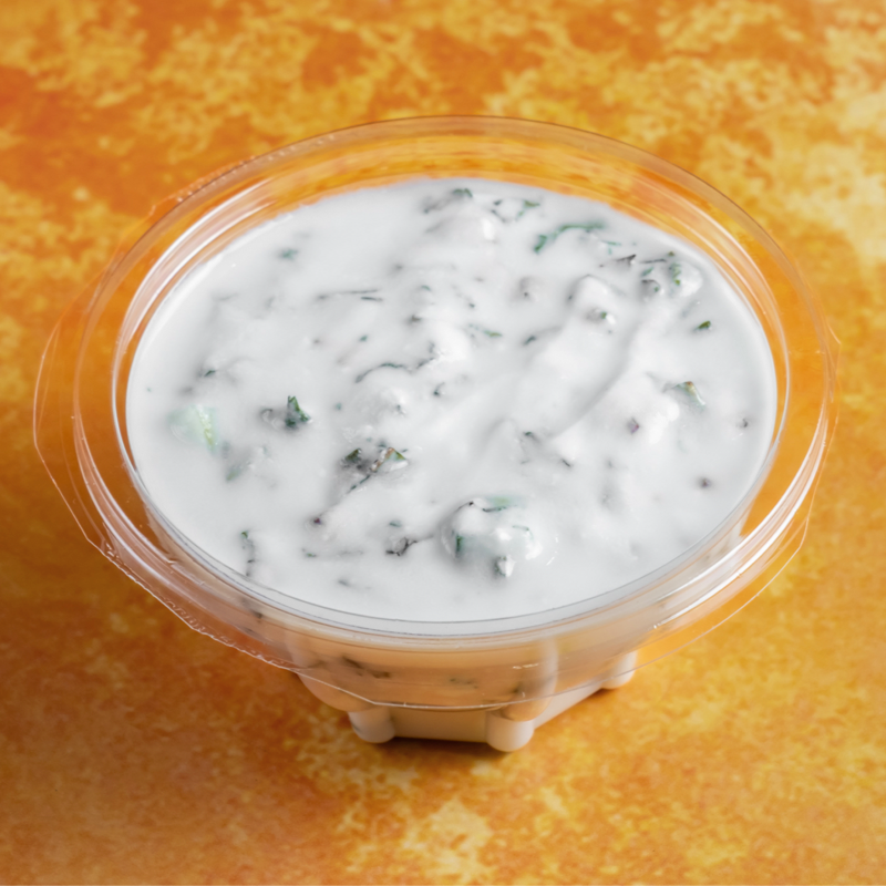 Large container of fresh green mint sauce