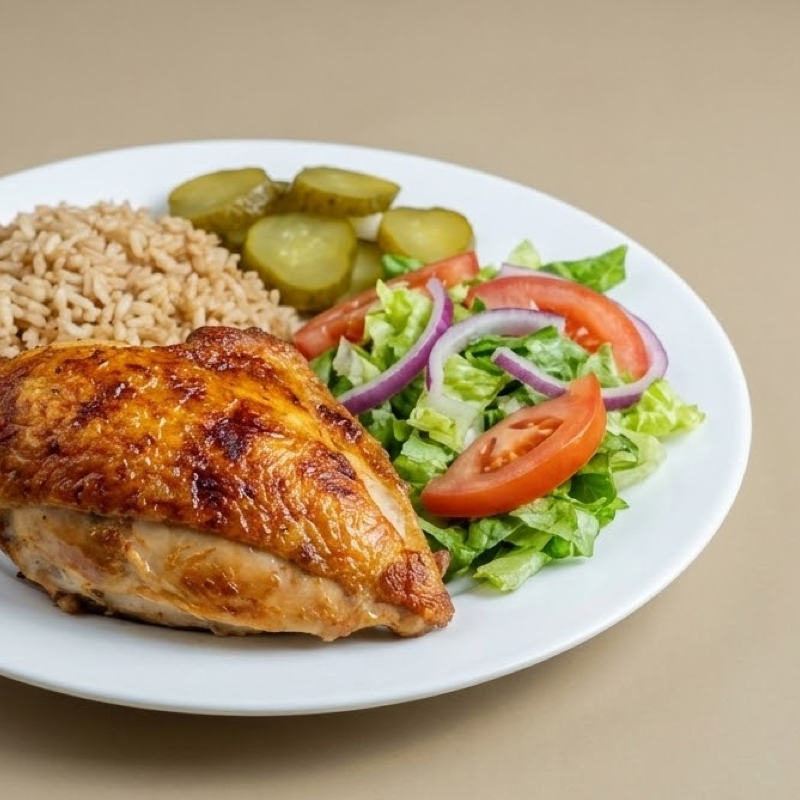 Quarter rotisserie chicken served with salad and fries